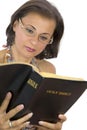 Beautiful woman reading bible