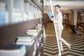 Beautiful woman is reading books in library Royalty Free Stock Photo