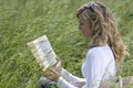 Beautiful Woman Reading Outdoors Royalty Free Stock Photo