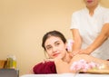 Beautiful woman receiving back massage in Asian traditional spa Royalty Free Stock Photo