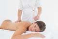 Beautiful woman receiving ear candle treatment at spa center Royalty Free Stock Photo