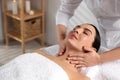 Beautiful woman receiving massage in beauty salon, closeup Royalty Free Stock Photo