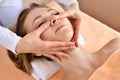 Beautiful woman receiving massage from female therapist in spa. Beauty wellness concept Royalty Free Stock Photo