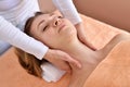 Beautiful woman receiving massage from female therapist in spa. Beauty wellness concept Royalty Free Stock Photo