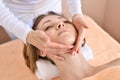 Beautiful woman receiving massage from female therapist in spa. Beauty wellness concept Royalty Free Stock Photo