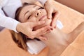 Beautiful woman receiving massage from female therapist in spa. Beauty wellness concept Royalty Free Stock Photo