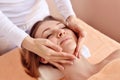 Beautiful woman receiving massage from female therapist in spa. Beauty wellness concept Royalty Free Stock Photo