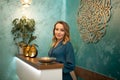 Beautiful woman at reception desk in yoga and wellness center