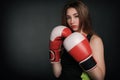 Beautiful woman with the red boxing gloves,black background Royalty Free Stock Photo
