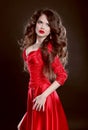 Beautiful Woman in red dress. Attractive fashion girl model with Royalty Free Stock Photo