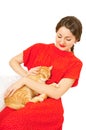 Beautiful woman in red dress with a cat Royalty Free Stock Photo