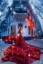 Beautiful woman in red dress in christmas portrait beauty portrait photoshoot Royalty Free Stock Photo