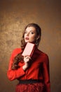 beautiful woman in red dress holding purse Royalty Free Stock Photo