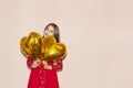 Woman holds heart shaped golden air balloons. valentines day, birthday, womens day, anniversary, holiday celebration concept Royalty Free Stock Photo