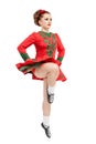 Beautiful woman in red dress for Irish dance jumping isolated Royalty Free Stock Photo