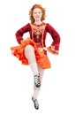 Beautiful woman in red dress for Irish dance jumping isolated Royalty Free Stock Photo