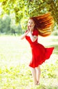 Beautiful woman with red fluttering hair Royalty Free Stock Photo