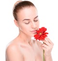 Beautiful woman with red gerbera. Isolated on Royalty Free Stock Photo