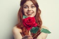 beautiful woman with red hair red rose flower close up Royalty Free Stock Photo