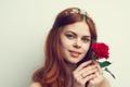 beautiful woman with red hair red rose flower close up Royalty Free Stock Photo