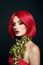 Beautiful woman with red hair and a yellow python snake around her neck. Professional Bright Beauty Eye Makeup Yellow, Red