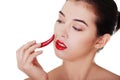 Beautiful woman with red hot chilly pepper Royalty Free Stock Photo