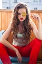 Beautiful woman with red lips eats candy big sweet lollipop Royalty Free Stock Photo