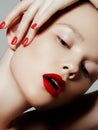 Beautiful woman with red matte lipstick. Beautiful woman face. Makeup detail. Beauty girl with perfect skin. Red lips