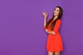 Beautiful Woman In Red Mini Dress Is Smiling And Showing Ok Hand Sign Royalty Free Stock Photo