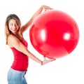 Beautiful woman with red shirt holding a mega balloon Royalty Free Stock Photo