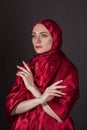beautiful woman in the red silk dress of the Eastern Muslim peoples Royalty Free Stock Photo