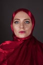 Beautiful woman in the red silk dress of the Eastern Muslim peoples Royalty Free Stock Photo