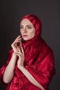 beautiful woman in the red silk dress of the Eastern Muslim peoples Royalty Free Stock Photo