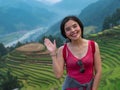 Woman in read tanktop at Mu cang chai rice terraces