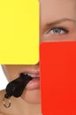 Beautiful woman, red and yellow soccer referee and whistle Royalty Free Stock Photo