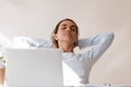 Beautiful woman relaxing on chair at work with eyes closed Royalty Free Stock Photo