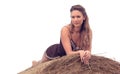 Beautiful woman relaxing on hay bale in summer Royalty Free Stock Photo