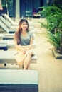 Beautiful woman relaxing on lounger near swimming pool in hotel, krabi, Thailand Royalty Free Stock Photo