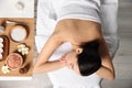 Beautiful woman relaxing on massage table in spa salon, top view Royalty Free Stock Photo