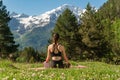 Beautiful woman relaxing and meditating outdoor at mountain Royalty Free Stock Photo