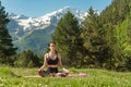 Beautiful woman relaxing and meditating outdoor at mountain Royalty Free Stock Photo