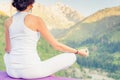 Beautiful woman relaxing and meditating outdoor at mountain Royalty Free Stock Photo