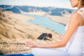 Beautiful woman relaxing and meditating outdoor at mountain Royalty Free Stock Photo