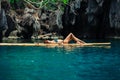 Beautiful woman relaxing on raft in tropical lagoon Royalty Free Stock Photo