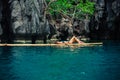 Beautiful woman relaxing on raft in tropical lagoon Royalty Free Stock Photo