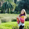 Beautiful woman relaxing and smiling in a park