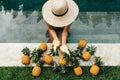 Beautiful Woman Relaxing In Swimming Pool With Pineapples. Healthy Lifestyle, Nutrition, Diet. Summer Vacation Royalty Free Stock Photo