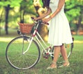 Beautiful woman riding bicycle in park and enjoying beautiful sunny day Royalty Free Stock Photo