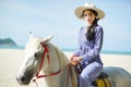 Beautiful woman riding a horse at the beach