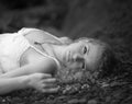 Beautiful woman at the rocky beach. Royalty Free Stock Photo